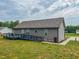 Home exterior featuring ramp access to back deck and open yard space at 112 Tillburg Ln, Hurdle Mills, NC 27541