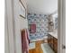 Tastefully designed bathroom with colorful wallpaper and modern fixtures at 112 Tillburg Ln, Hurdle Mills, NC 27541