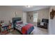 Cozy bedroom with baseball-themed bedding, neutral paint, and natural light at 112 Tillburg Ln, Hurdle Mills, NC 27541