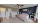 Cozy bedroom with a plush bed, ensuite bath, and decorative accents at 112 Tillburg Ln, Hurdle Mills, NC 27541