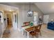 Charming dining area featuring a pendant light fixture and seating for four people at 112 Tillburg Ln, Hurdle Mills, NC 27541