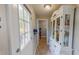 Hallway with an outdoor view, a display cabinet, and a shoe rack at 112 Tillburg Ln, Hurdle Mills, NC 27541