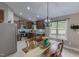 Bright kitchen and dining area featuring stainless steel appliances and lots of cabinet space at 112 Tillburg Ln, Hurdle Mills, NC 27541
