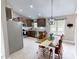 Well lit kitchen and dining room featuring stainless steel appliances and natural lighting at 112 Tillburg Ln, Hurdle Mills, NC 27541