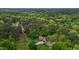 A charming home with outbuildings surrounded by dense trees with a long private driveway at 113 Denard St, Oxford, NC 27565