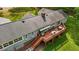 Aerial view of the back of the house with large deck surrounded by mature trees at 113 Denard St, Oxford, NC 27565