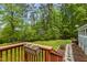 Scenic view of the backyard from the deck, showcasing a stone path and landscaping at 113 Denard St, Oxford, NC 27565