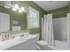 Traditional bathroom with a garden green paint and an enclosed shower and tub at 113 Denard St, Oxford, NC 27565