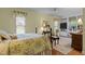 Cozy bedroom with floral bedding, built-in bookshelves, and natural light at 113 Denard St, Oxford, NC 27565