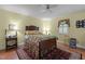 Bedroom with a floral-patterned bed, hardwood floors, and natural light at 113 Denard St, Oxford, NC 27565