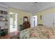 Bright bedroom with floral comforter and ample closet space at 113 Denard St, Oxford, NC 27565
