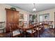 Formal dining room with a large wooden table, chairs, and an antique wooden cabinet at 113 Denard St, Oxford, NC 27565