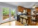 Kitchen with breakfast bar and walkout access to the outdoor wooden deck at 113 Denard St, Oxford, NC 27565