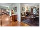 Inviting living room featuring hardwood floors and classic decor, leading to dining area at 113 Denard St, Oxford, NC 27565