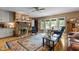 Inviting living room with a brick fireplace and access to an outdoor deck at 113 Denard St, Oxford, NC 27565