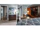 Comfortable bedroom with a decorative bedspread, vintage furniture and soft lighting at 113 Denard St, Oxford, NC 27565