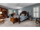 Spacious bedroom featuring hardwood furniture and natural light from large window at 113 Denard St, Oxford, NC 27565