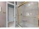 Well-maintained stand up shower with a clear glass door and a built-in seat at 113 Denard St, Oxford, NC 27565