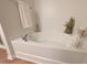 Relaxing soaking tub with brushed nickel faucet and white towels at 1145 Raven Perch Dr, Wendell, NC 27591