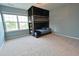 Bedroom with built-in bunk beds and window, featuring carpet at 1145 Raven Perch Dr, Wendell, NC 27591