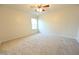 Bright bedroom featuring neutral walls, plush carpeting, a ceiling fan, and a window for natural light at 1145 Raven Perch Dr, Wendell, NC 27591