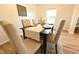 Charming dining room featuring a wooden table with six upholstered chairs and elegant decor at 1145 Raven Perch Dr, Wendell, NC 27591