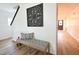 Inviting foyer with a decorative wall piece, bench seating, and stylish flooring at 1145 Raven Perch Dr, Wendell, NC 27591