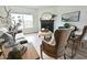 Bright living room with a black fireplace, mantel mirror, tan couch, and wood-look flooring at 1145 Raven Perch Dr, Wendell, NC 27591