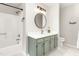 Tastefully updated bathroom featuring an updated vanity and a tub and shower combination at 1207 Candlewood Dr, Elon, NC 27244