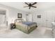 Light-filled bedroom with a ceiling fan, double closets, and an attached bathroom for added convenience at 1207 Candlewood Dr, Elon, NC 27244