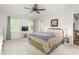 Bright and spacious bedroom featuring large windows, a ceiling fan, and neutral walls at 1207 Candlewood Dr, Elon, NC 27244