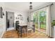 Bright dining area featuring a slider door to the outside deck with hardwood floors at 1207 Candlewood Dr, Elon, NC 27244