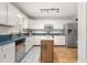 Spacious kitchen featuring stainless steel appliances, island, and contrasting countertops at 1207 Candlewood Dr, Elon, NC 27244