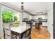 Bright eat-in kitchen showcasing stainless appliances and a slider door to the deck at 1207 Candlewood Dr, Elon, NC 27244