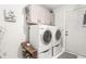 Efficient laundry area with stacked washer and dryer plus updated cabinets for optimal storage at 1207 Candlewood Dr, Elon, NC 27244
