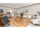 Neutral living room featuring wood floors, decorative accents, and plenty of natural light at 1207 Candlewood Dr, Elon, NC 27244