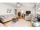 Open living space showcasing neutral tones, fireplace, and lots of natural light at 1207 Candlewood Dr, Elon, NC 27244