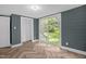 Bedroom featuring luxury vinyl floors, a sliding glass door and neutral paint at 1219 Junction Rd, Durham, NC 27704