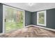 Bedroom with luxury vinyl floors, natural light, and neutral paint at 1219 Junction Rd, Durham, NC 27704