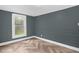 Bedroom with luxury vinyl floors, natural light, and neutral paint at 1219 Junction Rd, Durham, NC 27704