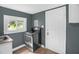 Kitchen featuring stainless steel oven and view of yard through window at 1219 Junction Rd, Durham, NC 27704