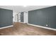 Spacious living room with wood-look flooring and neutral wall color at 1219 Junction Rd, Durham, NC 27704