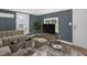 Stylish living room with comfortable seating, elegant decor, and views of the lush outdoor scenery at 1219 Junction Rd, Durham, NC 27704