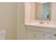 Neat bathroom with white vanity, ample storage, and a decorative mirror at 122 E Orange St, Hillsborough, NC 27278