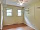 Bedroom showcasing hardwood floors, a ceiling fan, and custom shelving at 122 E Orange St, Hillsborough, NC 27278