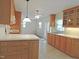 Spacious eat-in kitchen with light-colored countertops, and abundant cabinet and countertop space at 122 E Orange St, Hillsborough, NC 27278
