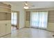 Living room with built-in shelving and a large window at 122 E Orange St, Hillsborough, NC 27278