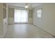 Bright living room with built-in shelving and large window at 122 E Orange St, Hillsborough, NC 27278