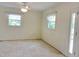 Bright room features two windows, and a doorway to outside at 122 E Orange St, Hillsborough, NC 27278