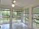 Sunroom featuring multiple sliding glass doors with access to outdoor deck at 122 E Orange St, Hillsborough, NC 27278